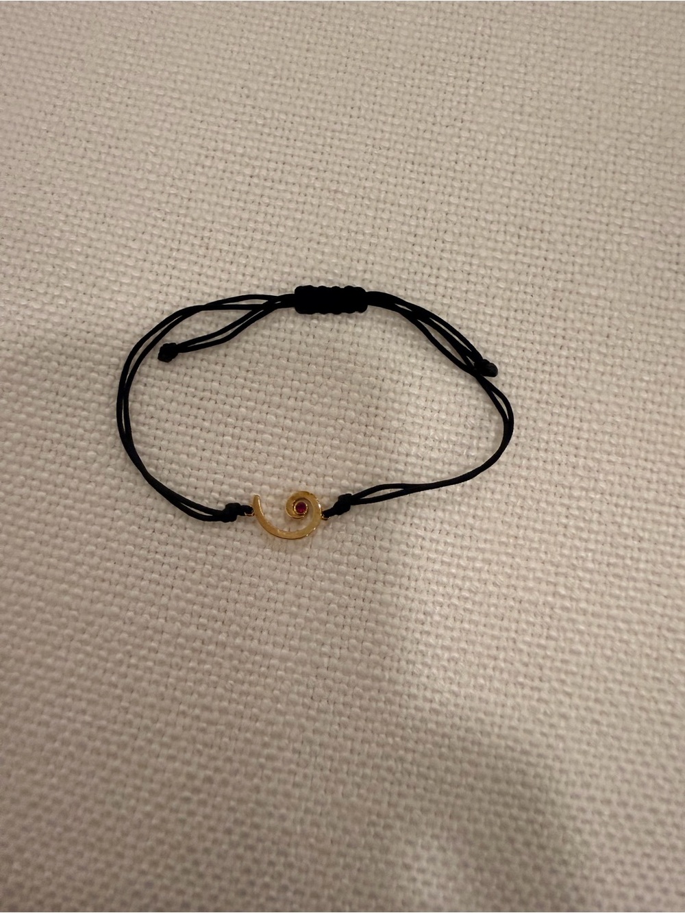 Adjustable Black Cord Bracelet with Gold Spiral Charm and Red Accent